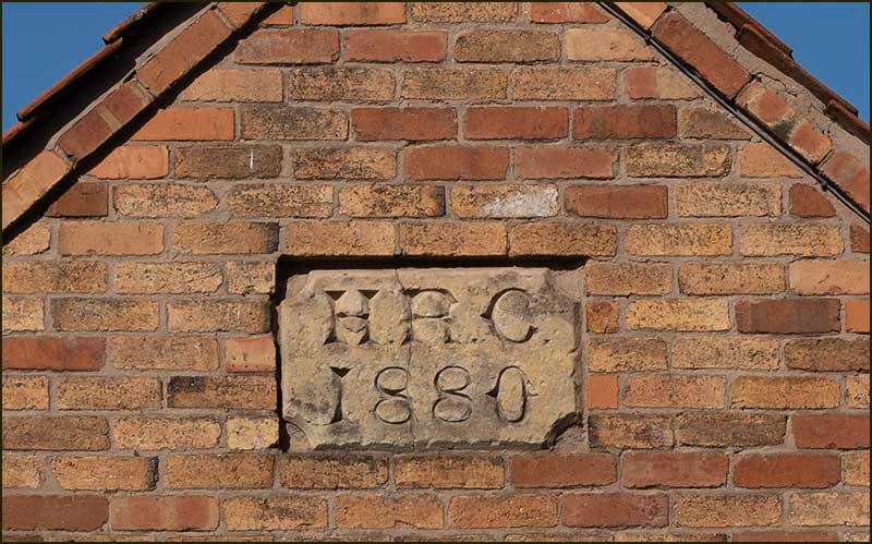 HRC plaque on end of barn