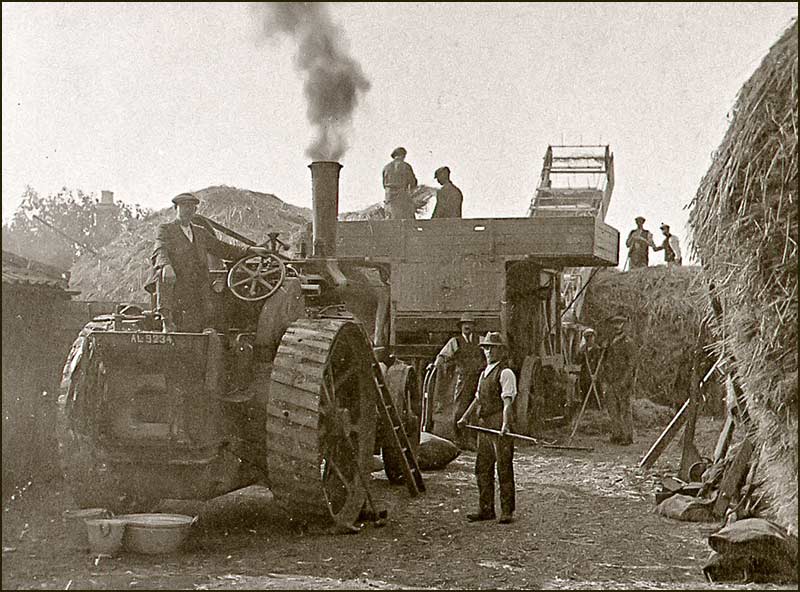Threshing machine in 1930s in Knight's stack yard