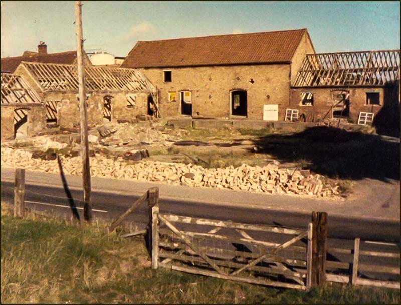 'The Yews' farm buildings being demolished in 1983