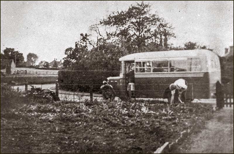 J. Lewis bus at bend at north end of Church Street outside Springfield Cottage