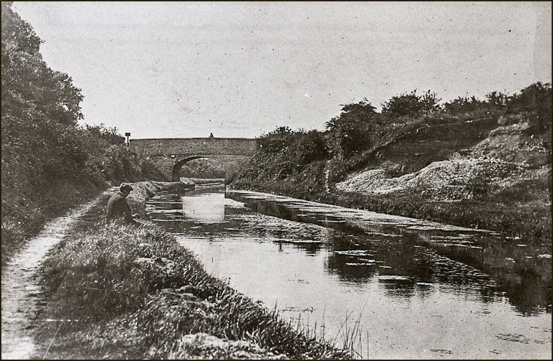 Man fishing near the Colson Bridge in 1930s