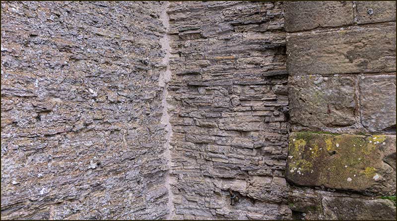 Comparing the walls of the nave and the porch