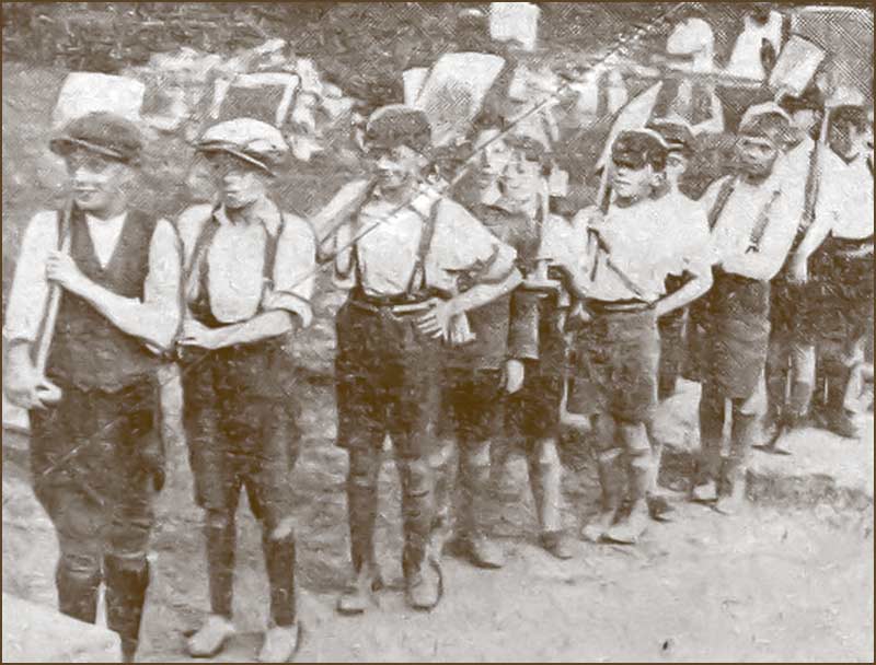 Boys helping to build the Memorial Hall