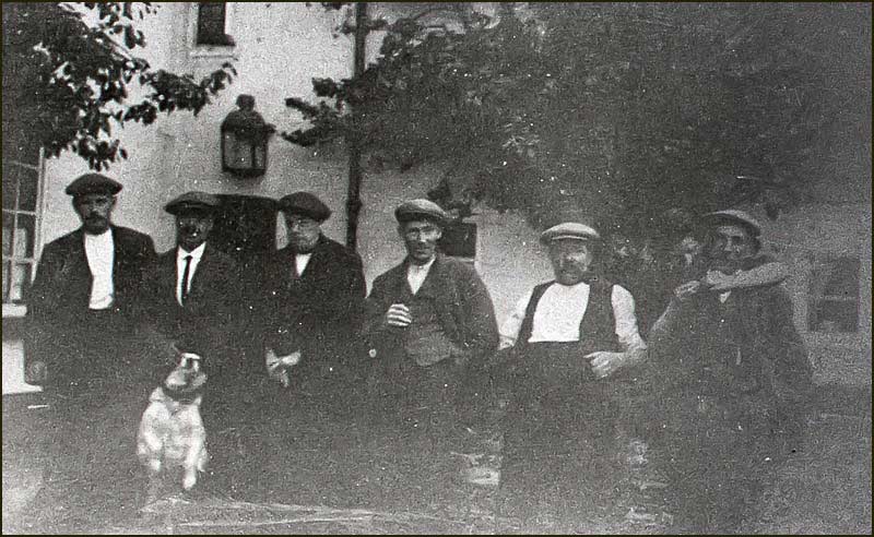 Men drinking in backyard of Wheatsheaf